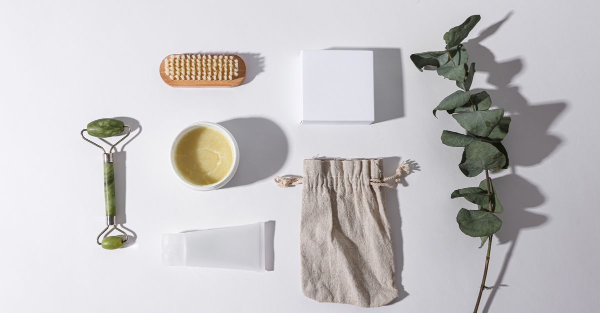 Flat lay of eco-friendly beauty tools with eucalyptus